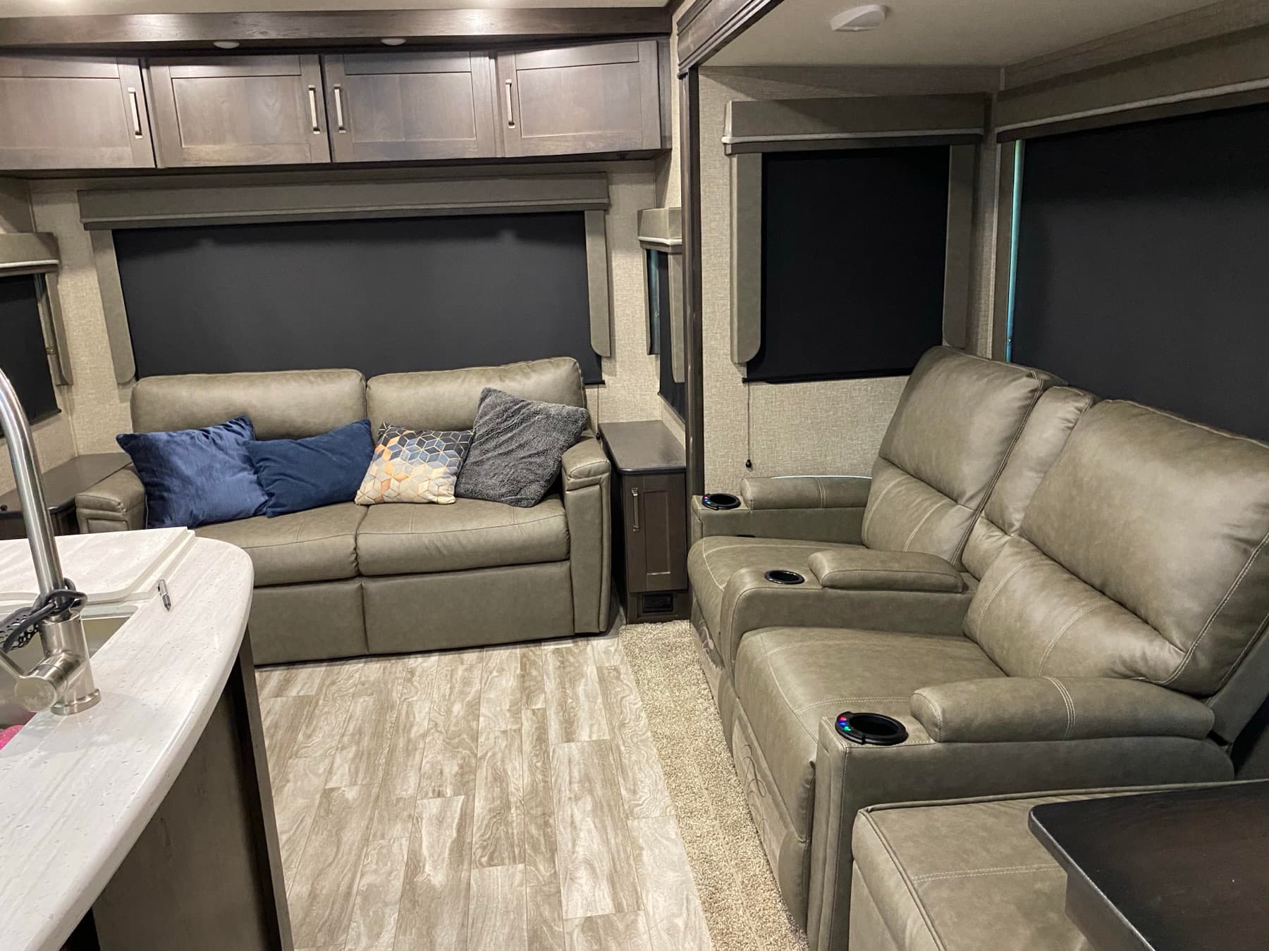 Rear living area — theater recliners and tri-fold sofa